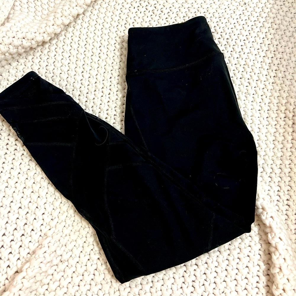 Black Victoria’s Secret leggings with mesh legs